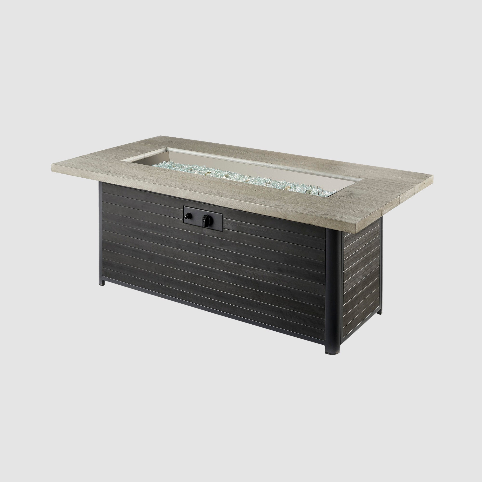Cedar Ridge Linear Gas Fire Pit Table with fire media placed on the burner on a grey background