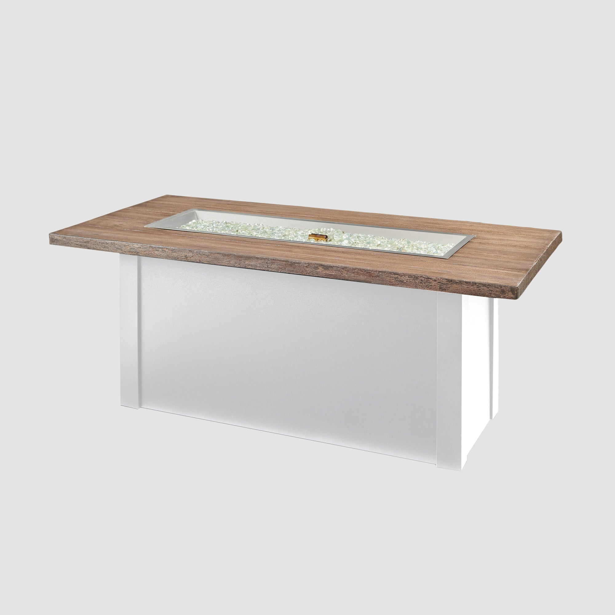 Fire gems placed on the burner of a Havenwood Linear Gas Fire Pit Table with a Driftwood top and White base