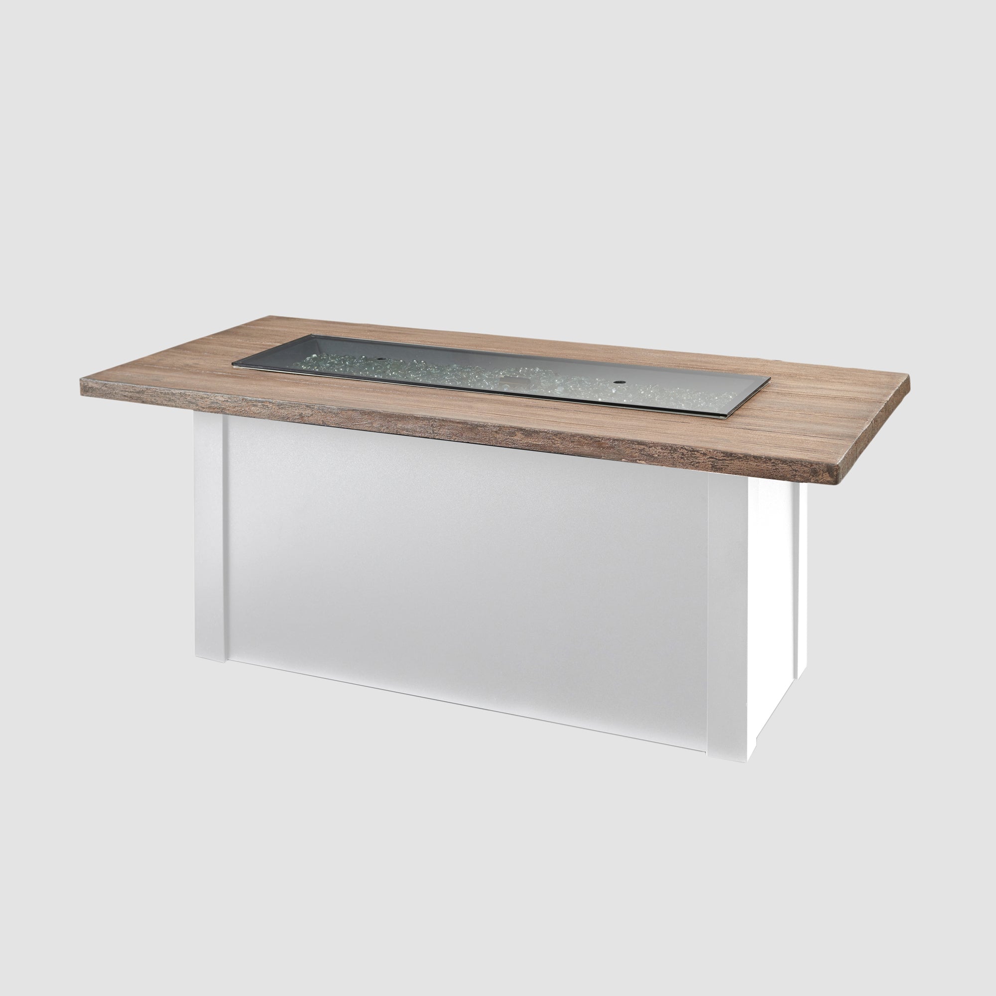 A cover placed on the burner of a Havenwood Linear Gas Fire Pit Table with a Driftwood top and White base