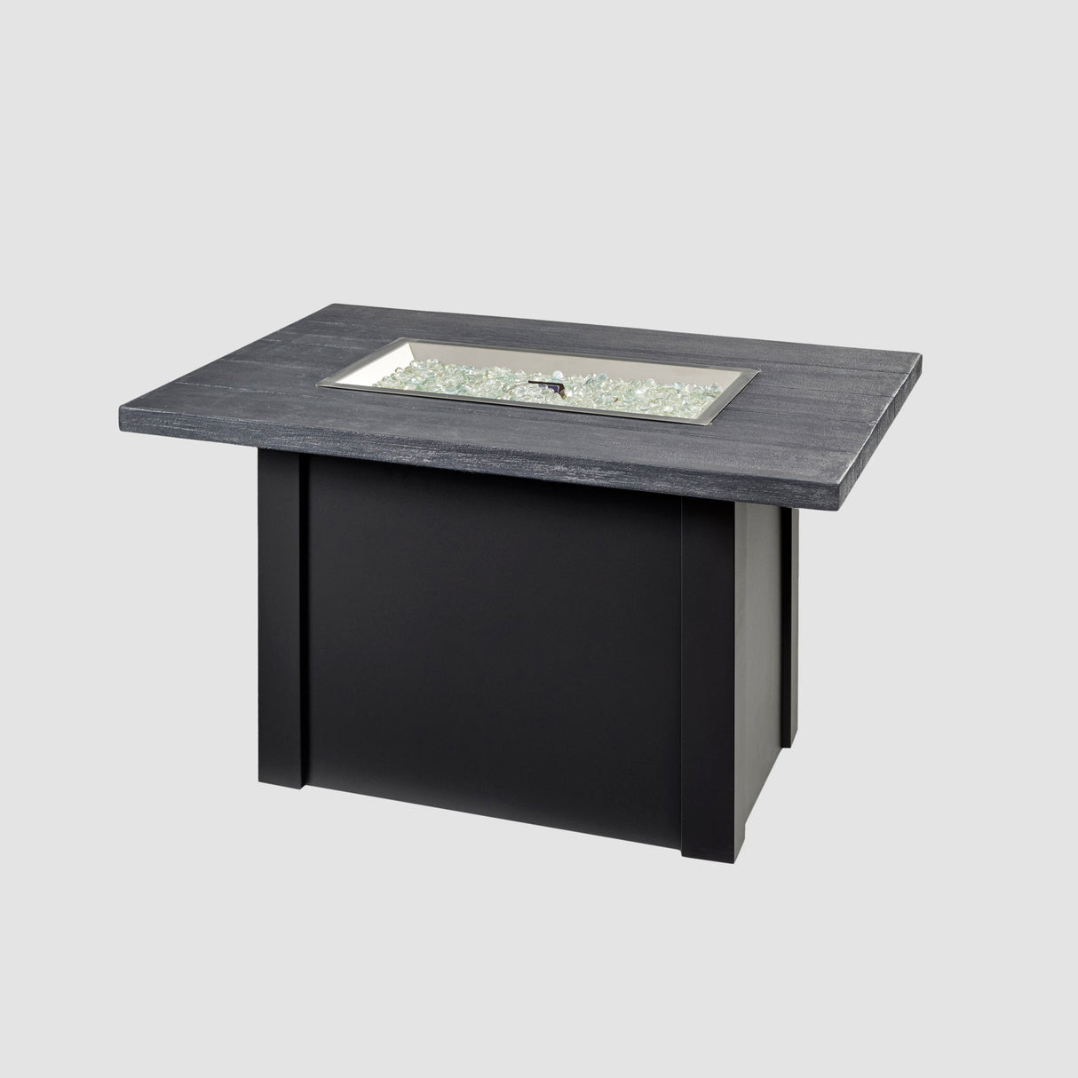 Fire media placed on the burner of a Havenwood Rectangular Gas Fire Pit Table with a Carbon Grey top and Luverne Black base