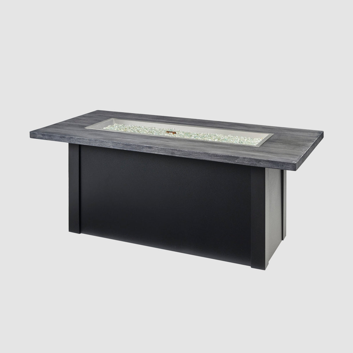 Fire gems placed on the burner of a Havenwood Linear Gas Fire Pit Table with a Carbon Grey top and Luverne Black base