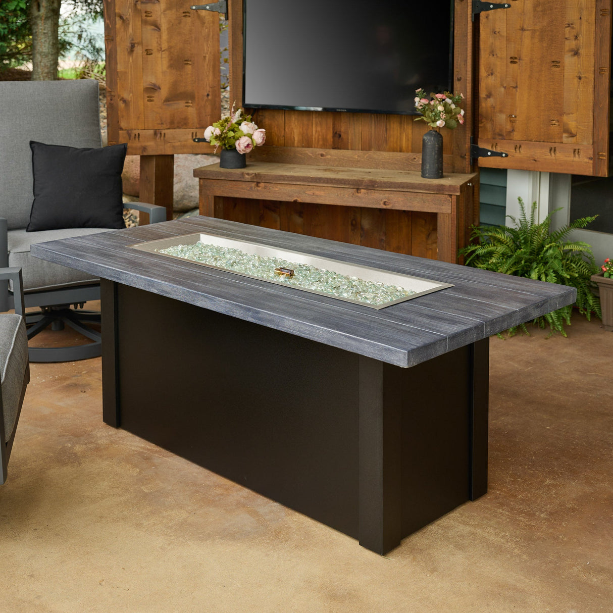 The Havenwood Linear Gas Fire Pit Table with a Carbon Grey top and Luverne Black base without a cover