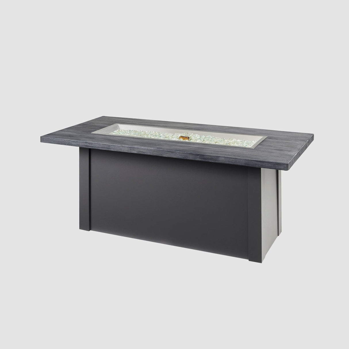Fire gems placed on the burner of a Havenwood Linear Gas Fire Pit Table with a Carbon Grey top and Graphite Grey base