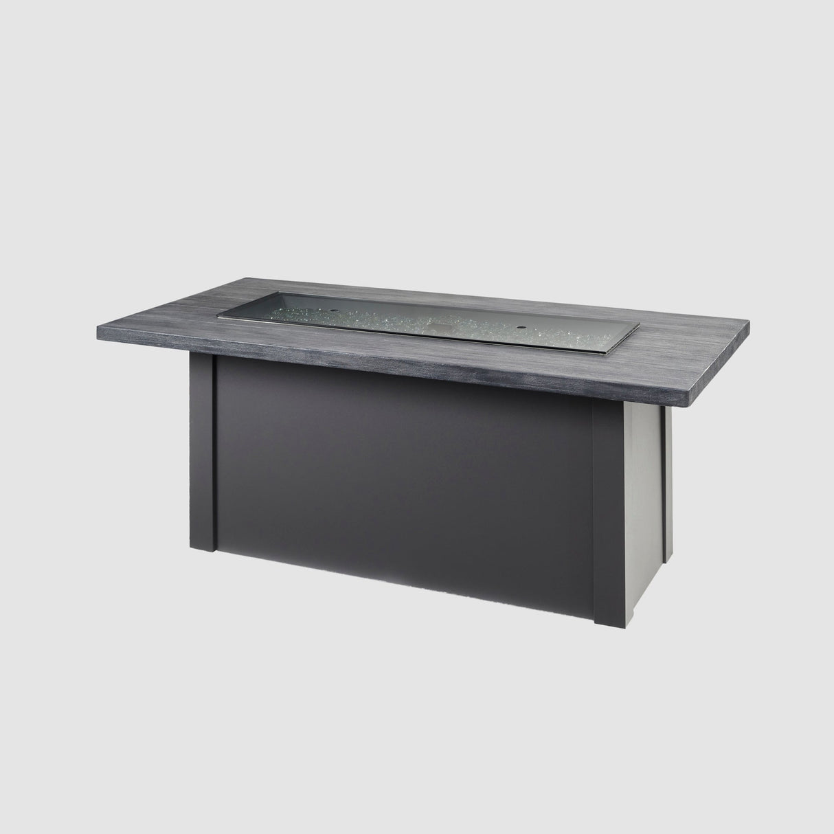 A cover placed on the burner of a Havenwood Linear Gas Fire Pit Table with a Carbon Grey top and Graphite Grey base