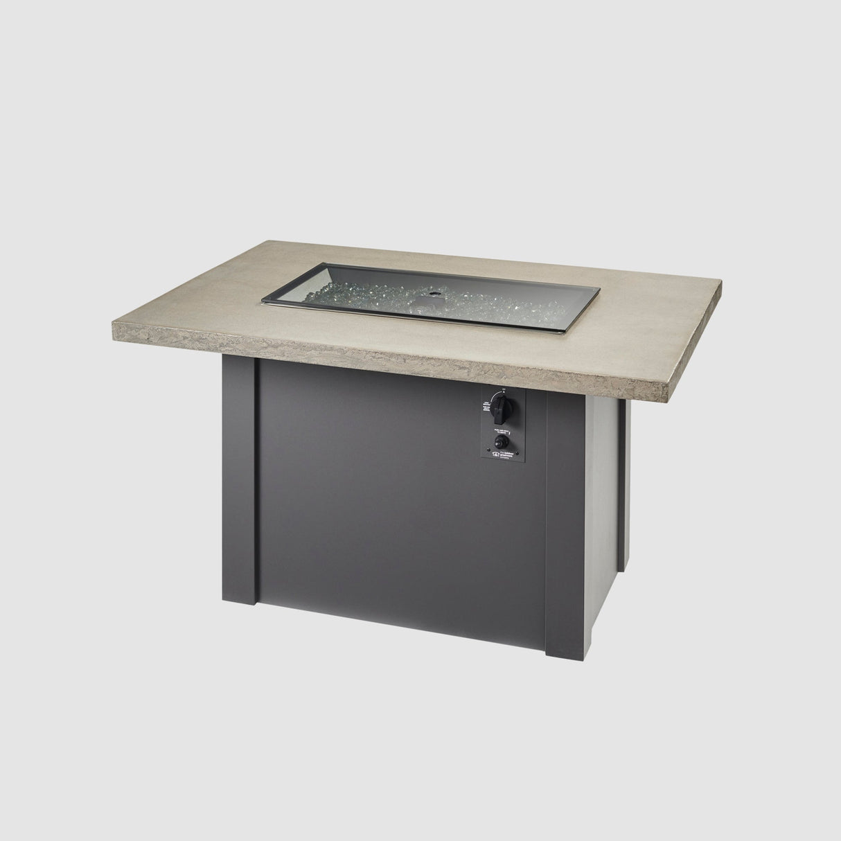 A cover placed on the burner of a Havenwood Rectangular Gas Fire Pit Table with a Pebble Grey top and Graphite Grey base