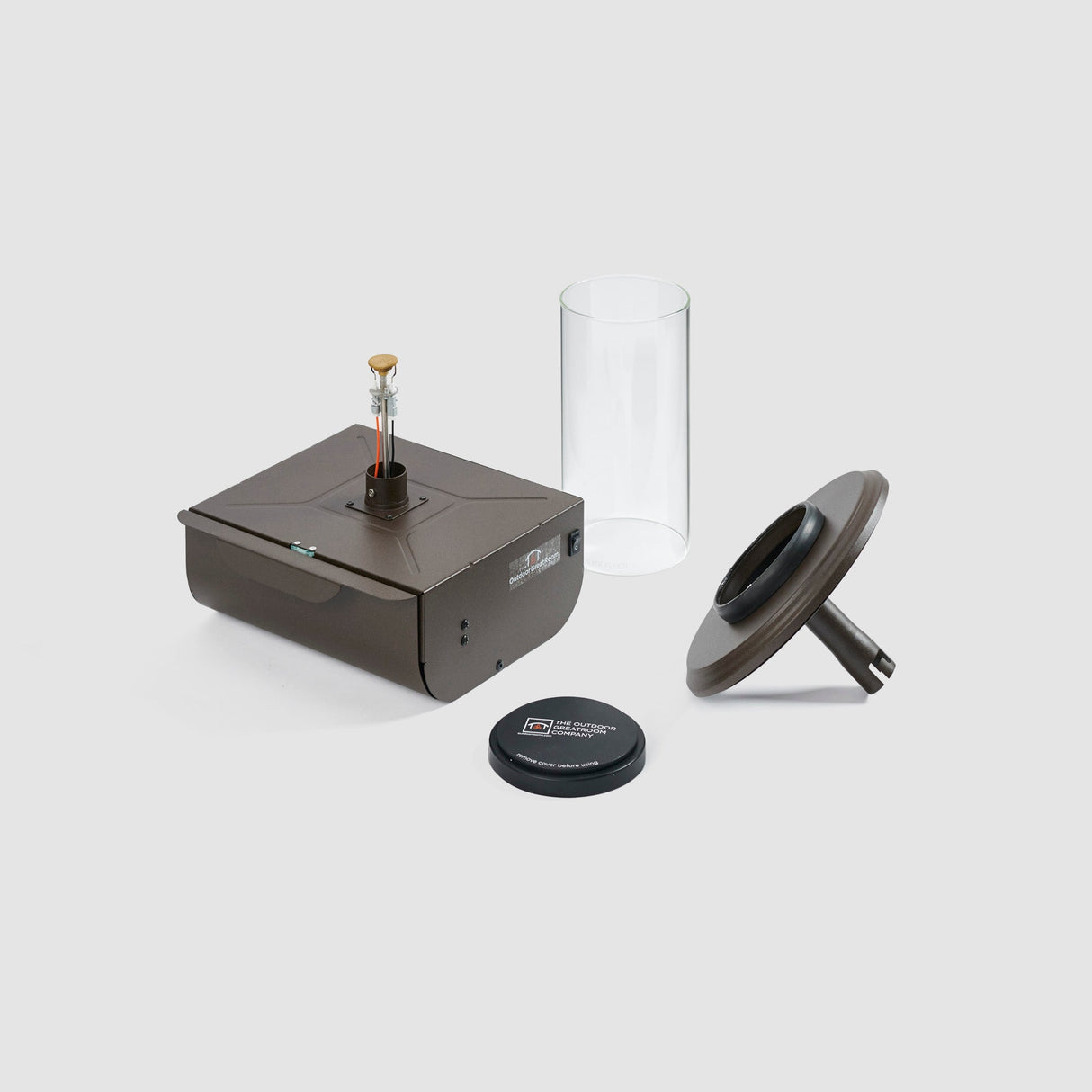 Components of the Intrigue Table Top Outdoor Lantern on a grey background