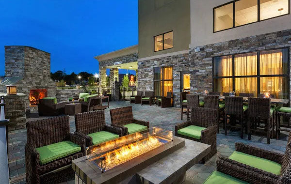 An outdoor commercial space using an Uptown Linear Gas Fire Pit Table