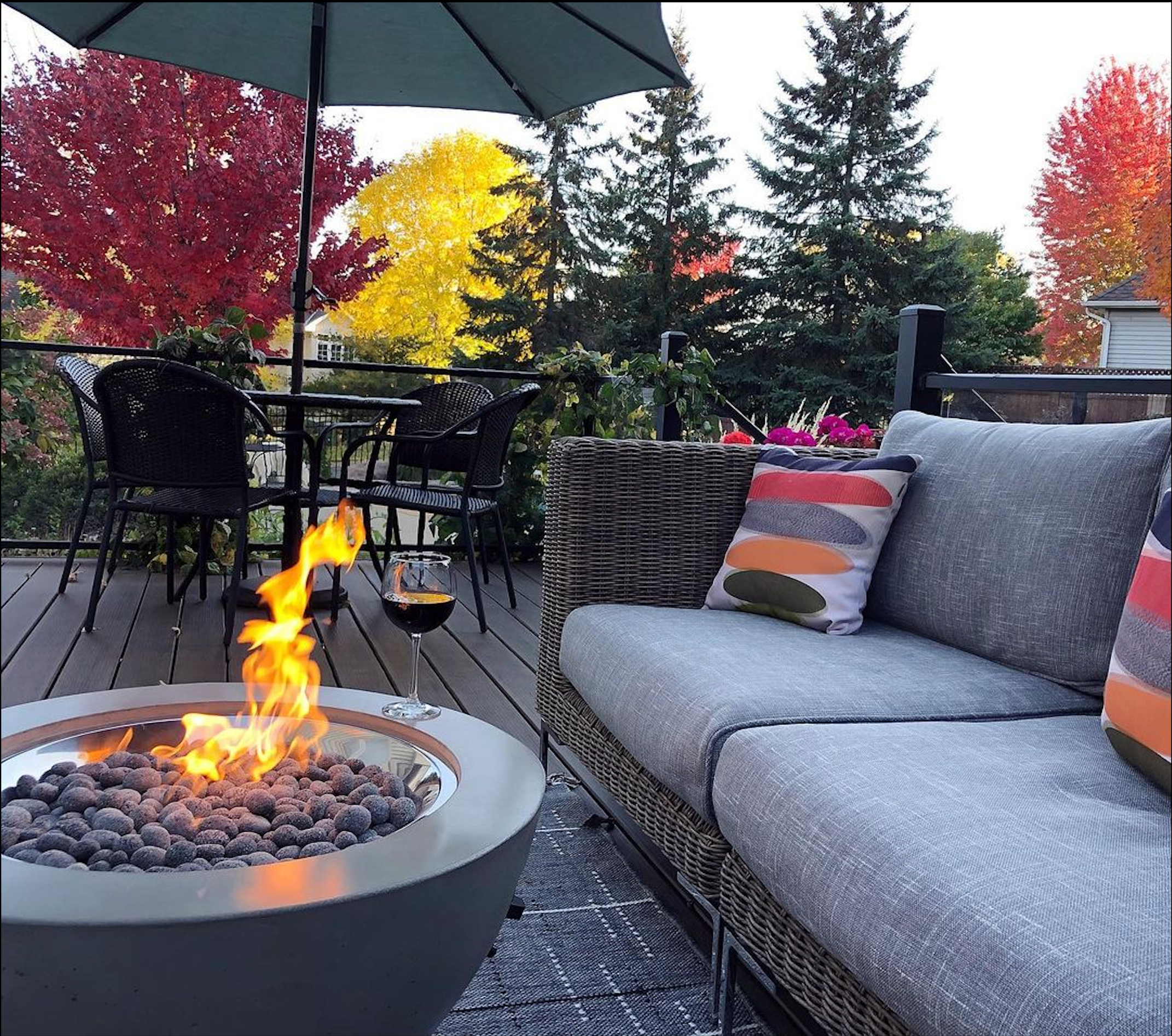 Outdoor GreatRoom CV-30 Natural Grey gas fire pit table on a patio