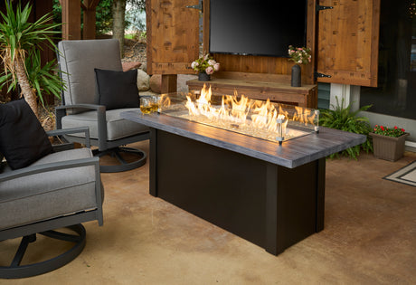 A Havenwood Linear Gas Fire Pit with a Luverne Black base and Charcoal Grey top.