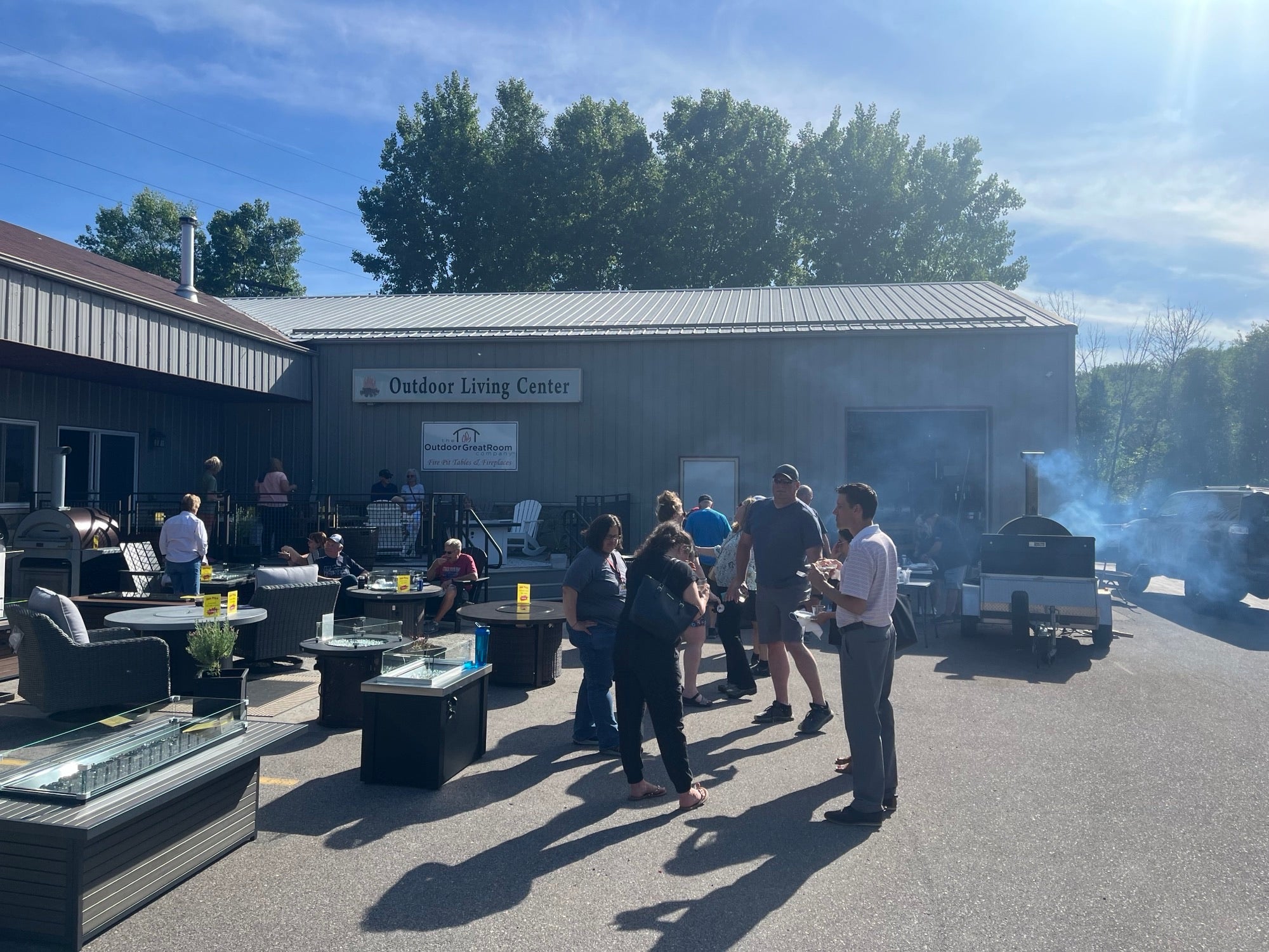 La Crosse Fireplace's event set up featuring several of The Outdoor GreatRoom Company's gas fire pit tables.