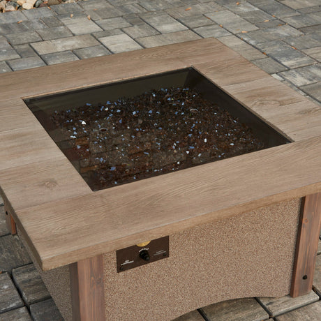 The Square Glass Burner Cover being used on an outdoor patio setting