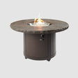 The Marbleized Noche Beacon Round Gas Fire Pit Table on a grey background