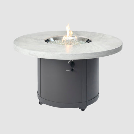 The White Onyx Beacon Round Gas Fire Pit Table on a grey background