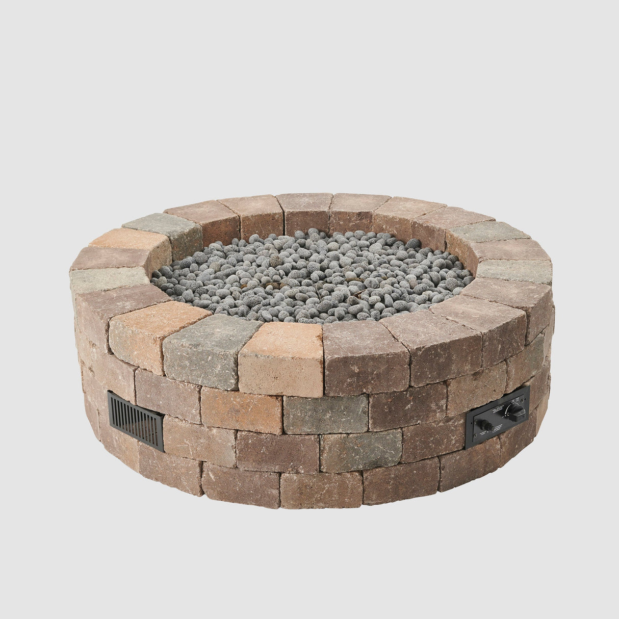 Lava rocks in the middle of a Bronson Block Round Gas Fire Pit Kit