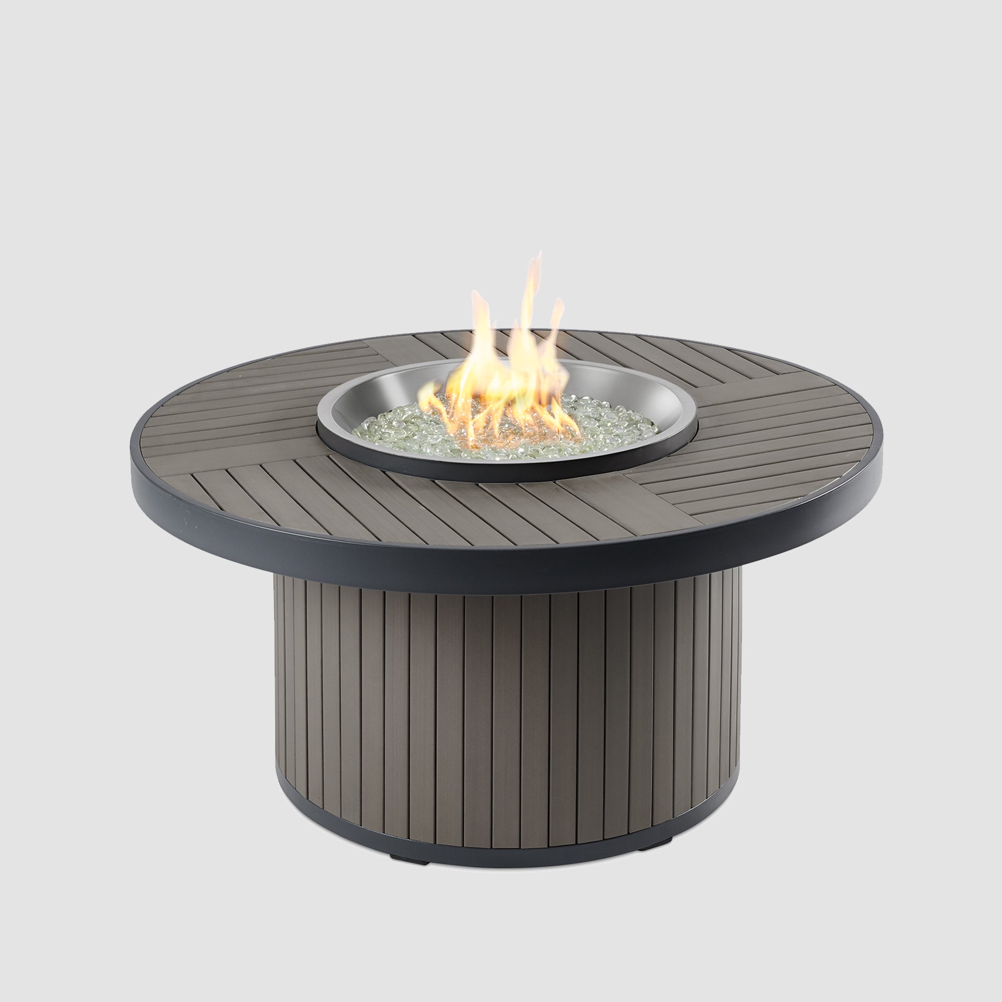 The Brooks Round Gas Fire Pit Table with flame on a grey background