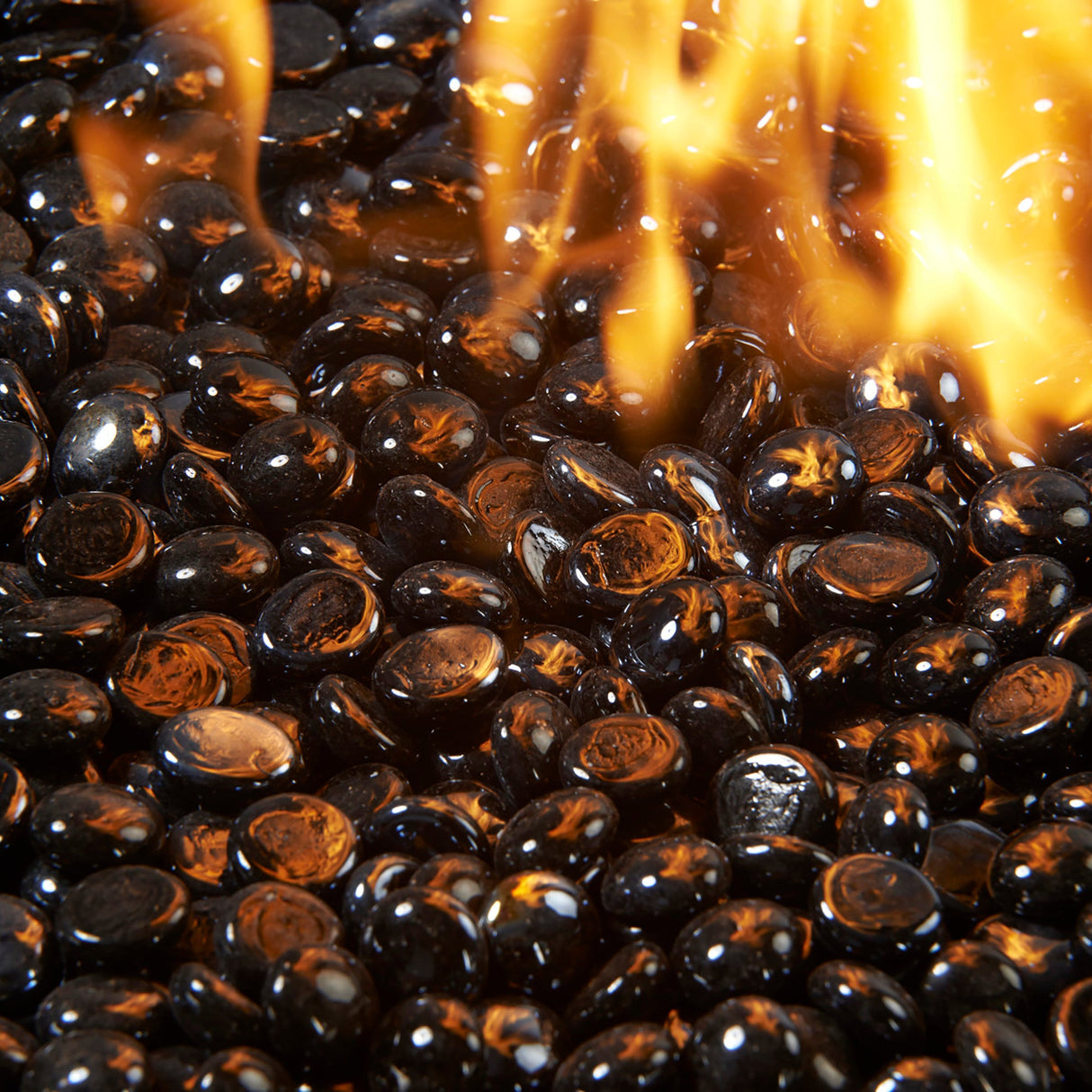 Close up of a flame coming through Onyx Tempered Fire Glass Gems for a Crystal Fire Burner
