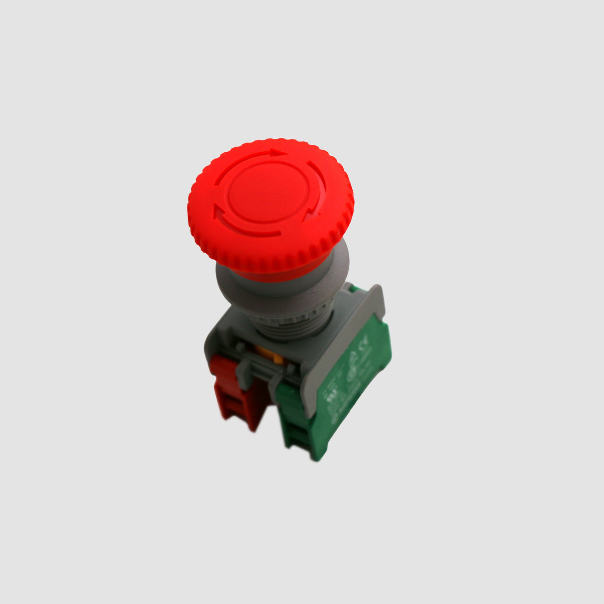 The Direct Spark Ignition System Emergency Stop Button on a grey background