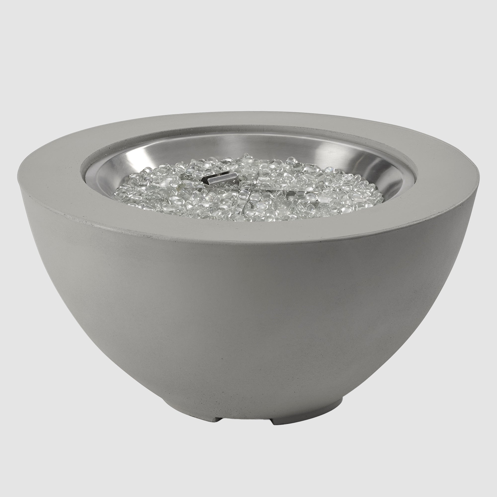 Fire gems on the burner of a Cove Round Gas Fire Pit Bowl 29" on a grey background