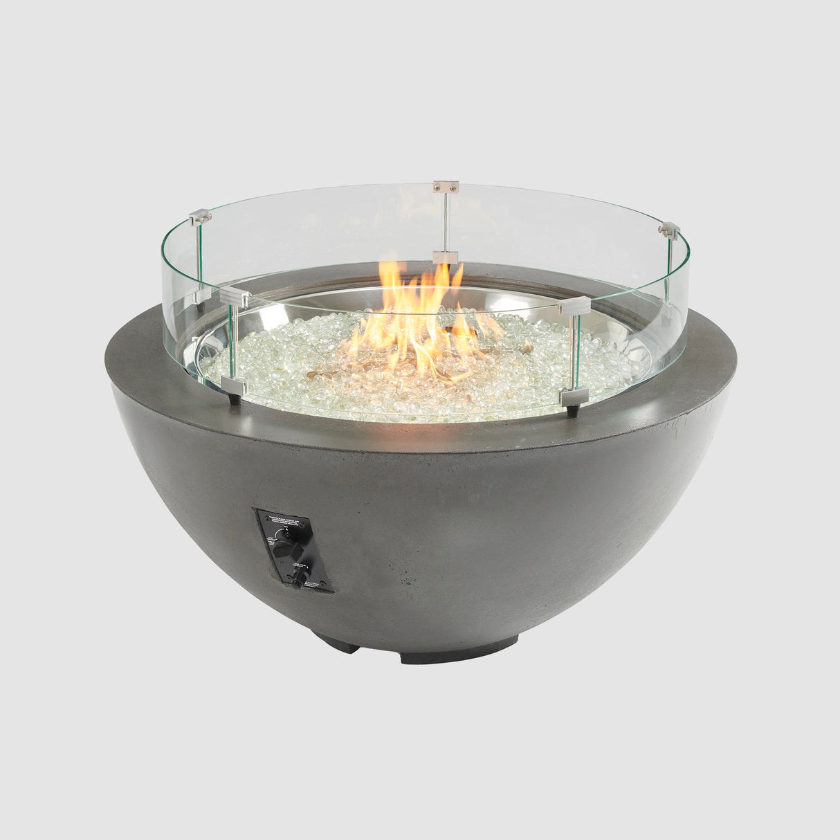 A glass wind guard placed on the top of a Midnight Mist Cove Round Gas Fire Pit Bowl 42"