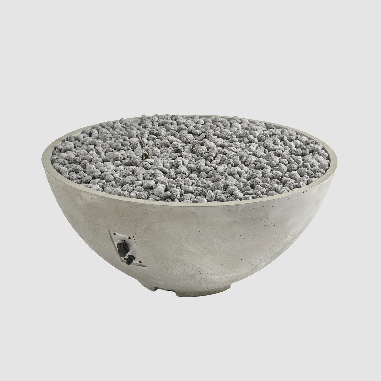 Lava rocks on the burner of a Natural Grey Cove Edge Round Gas Fire Pit Bowl 42"