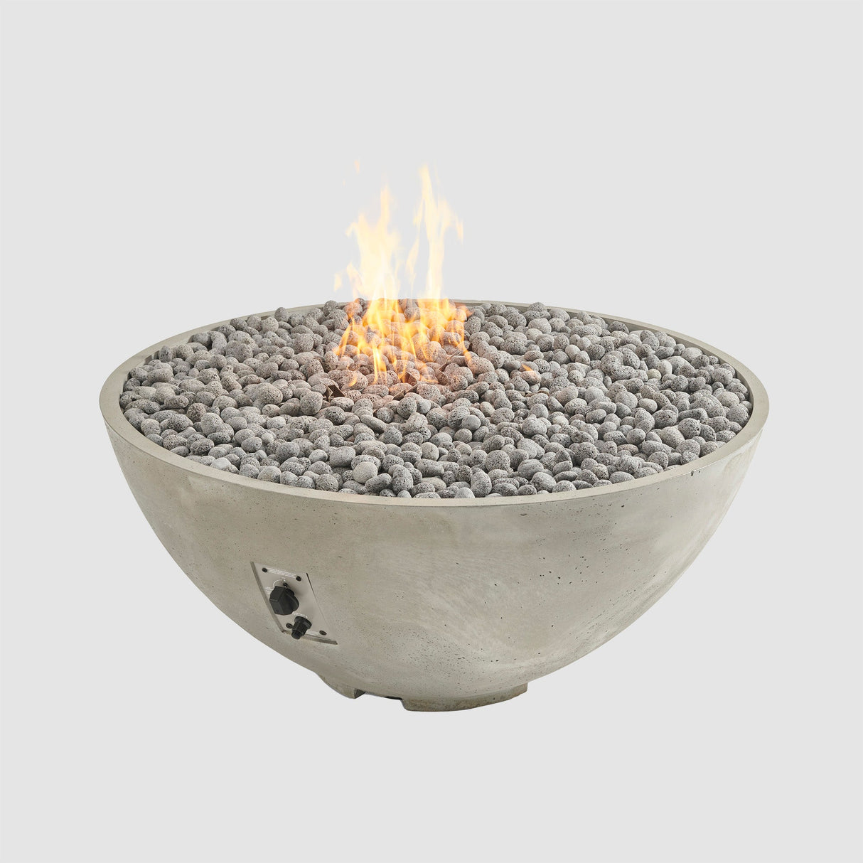 Lava rocks and a large flame coming from a Natural Grey Cove Edge Round Gas Fire Pit Bowl 42"
