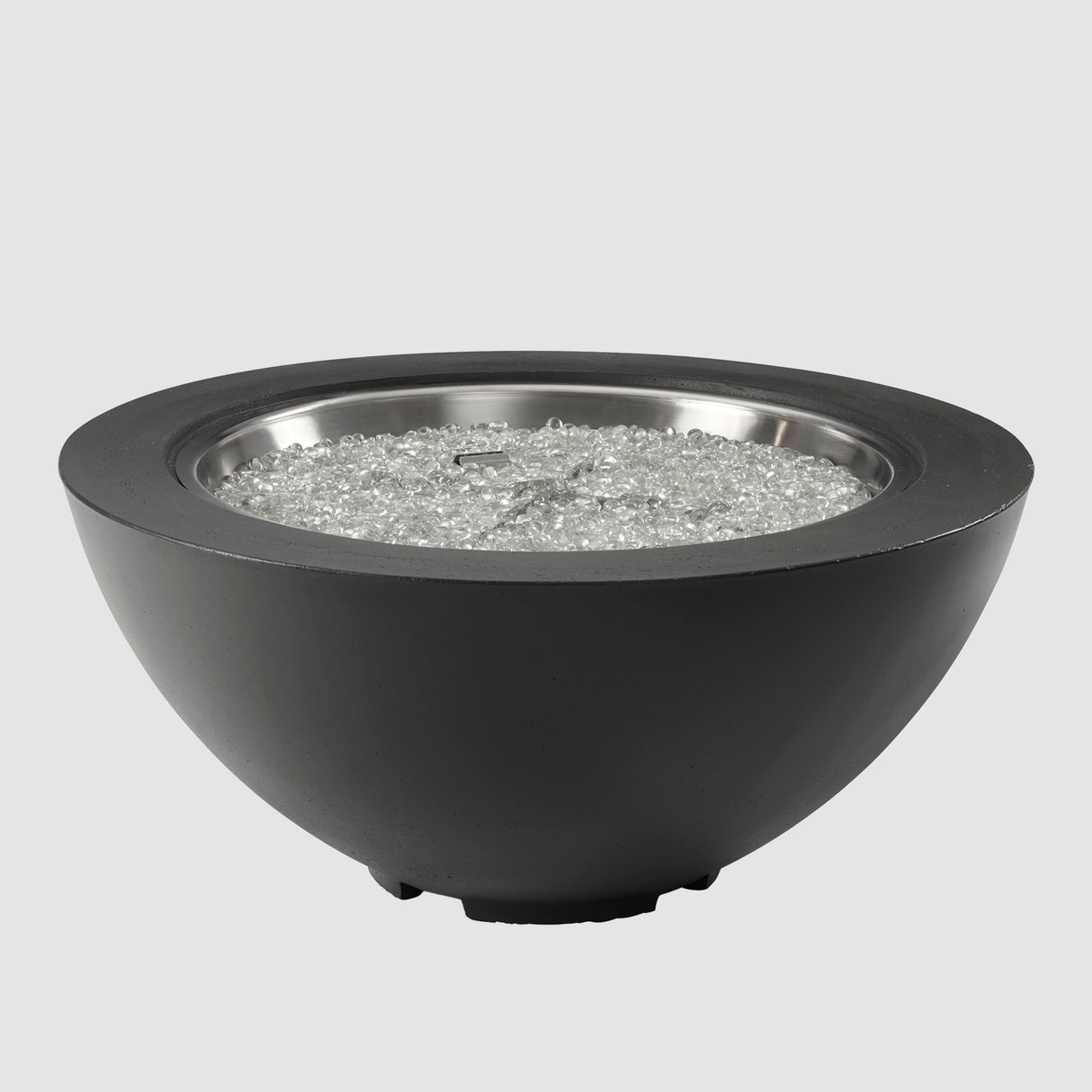 Fire gems on the burner of a Midnight Mist Cove Round Gas Fire Pit Bowl 29" on a grey background