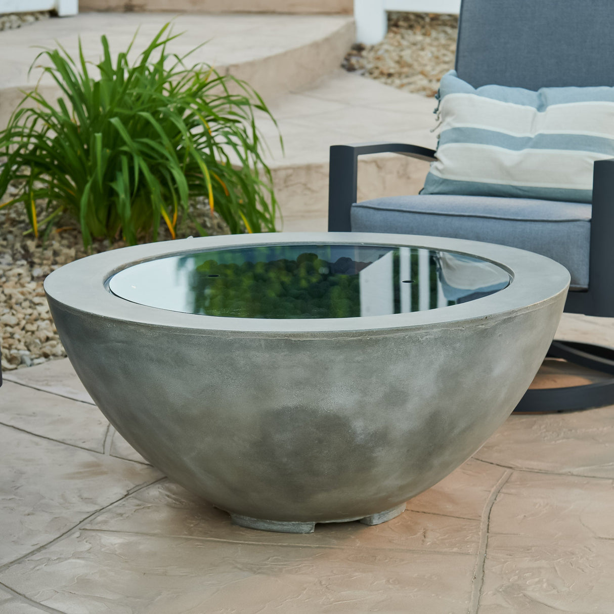 A cover placed on the Natural Grey Cove Round Gas Fire Pit Bowl 42" so it can be used as an outdoor table