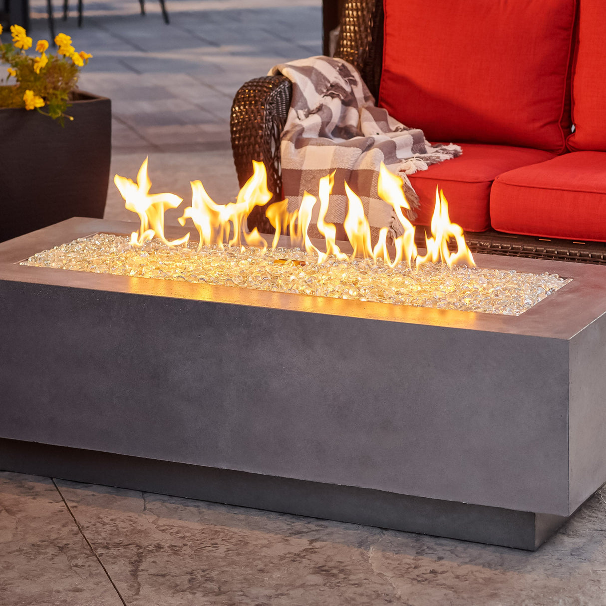 A close up of the flame produced by a Midnight Mist Cove Linear Gas Fire Pit Table 54"
