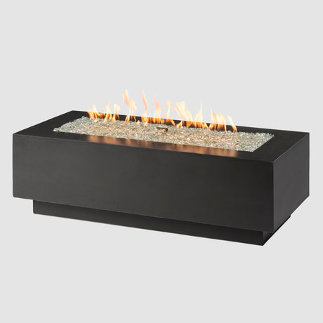 A Midnight Mist Cove Linear Gas Fire Pit Table 54" with Flame on a grey background