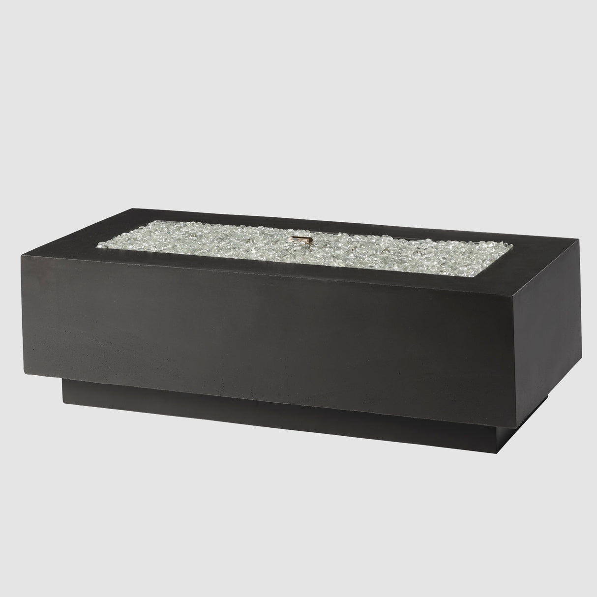 Fire gems on the burner of a Midnight Mist Cove Linear Gas Fire Pit Table 54" on a grey background