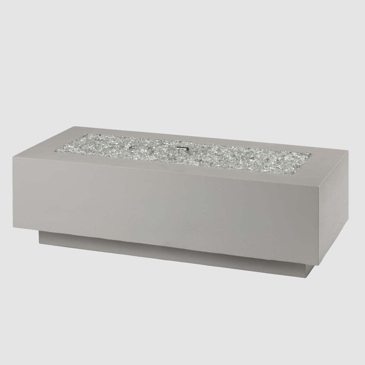 Fire gems on the burner of a Cove Linear Gas Fire Pit Table 54" on a grey background