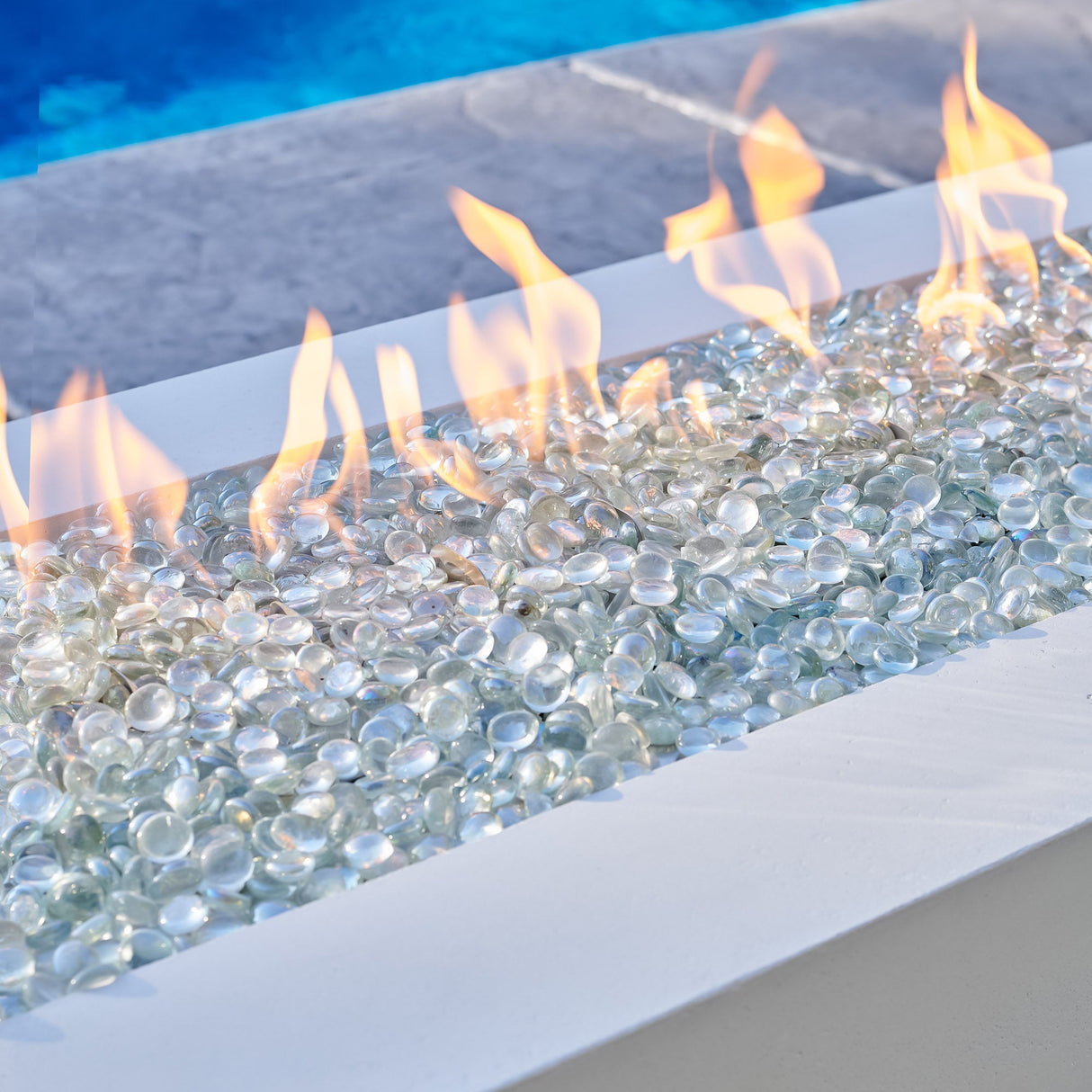 A close up view of the flames coming from the White Cove Linear Gas Fire Pit Table 72"