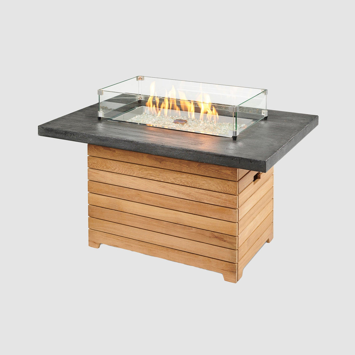 A glass wind guard placed on the top of a Darien Rectangular Gas Fire Pit Table with an Everblend top