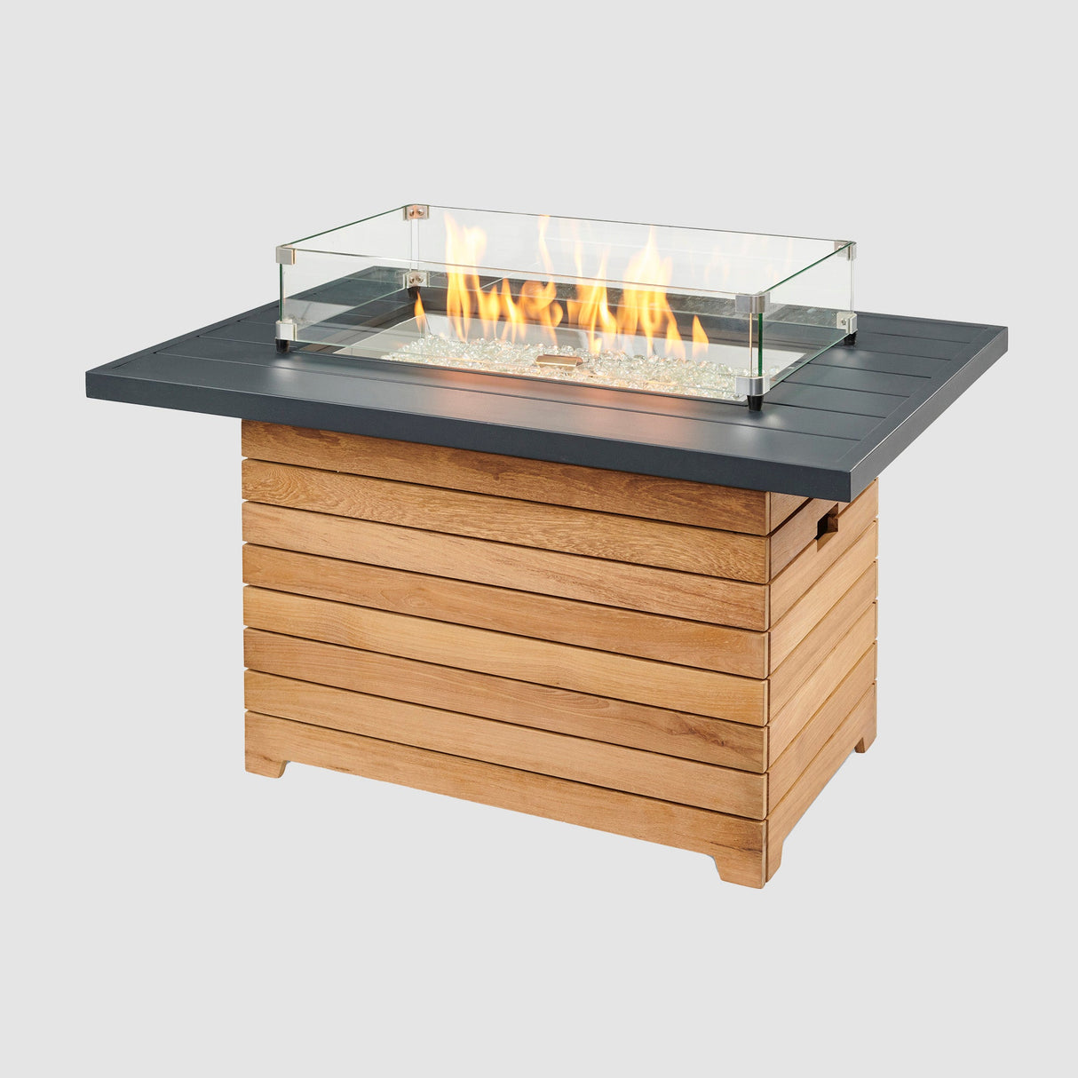 A glass wind guard placed on the top of a Darien Rectangular Gas Fire Pit Table with an Aluminum top