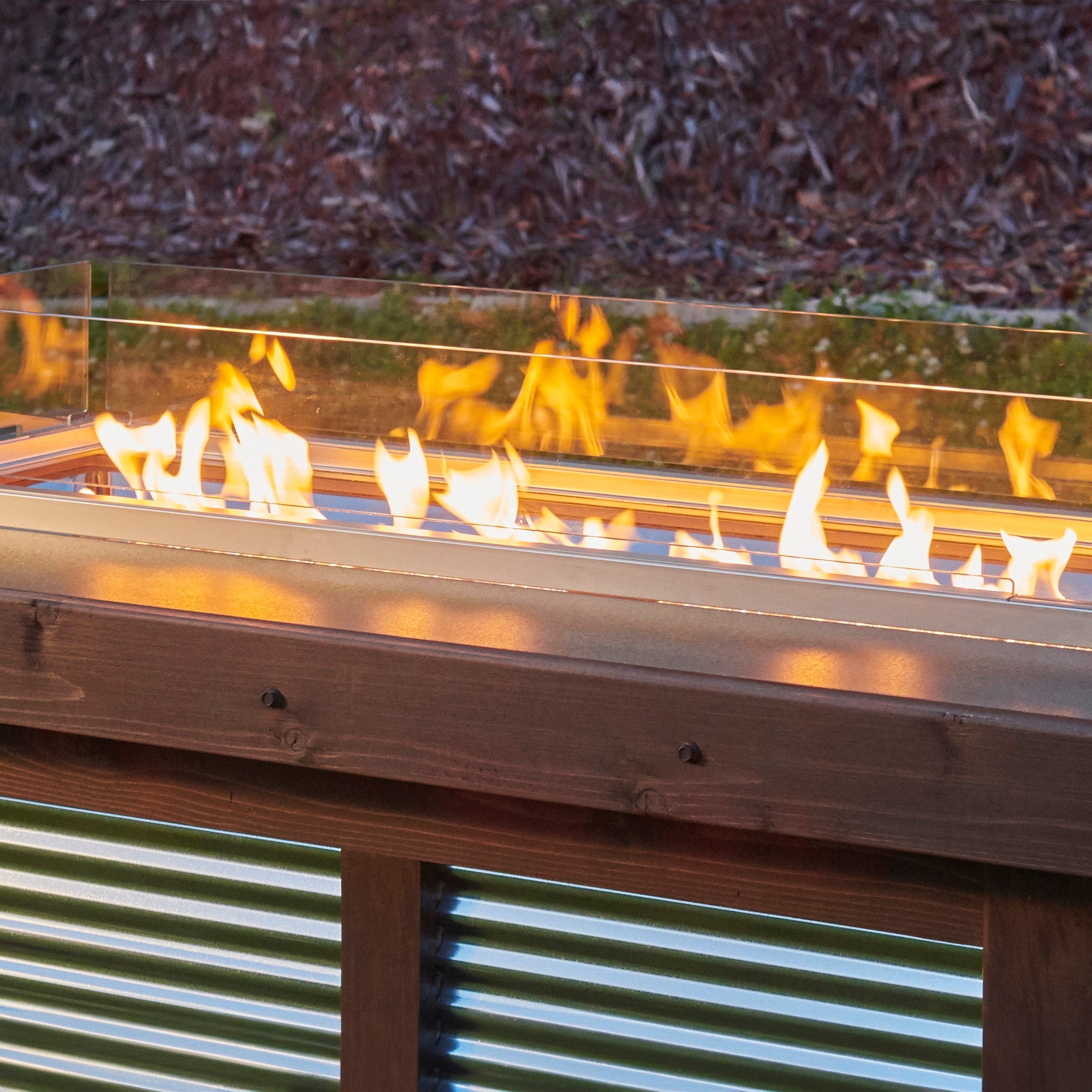 Close up of the The Rectangular Folding Glass Wind Guard in an outdoor patio setting