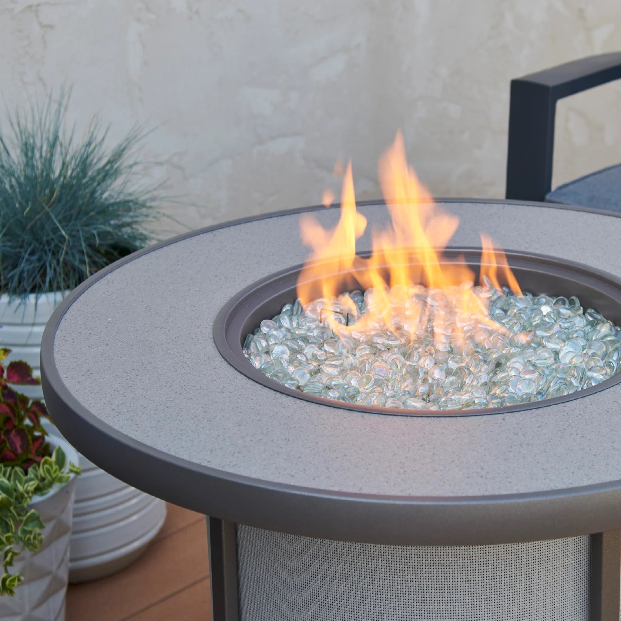 The Grey Stonefire Gas Fire Pit Table is a versatile and compact addition to any space.