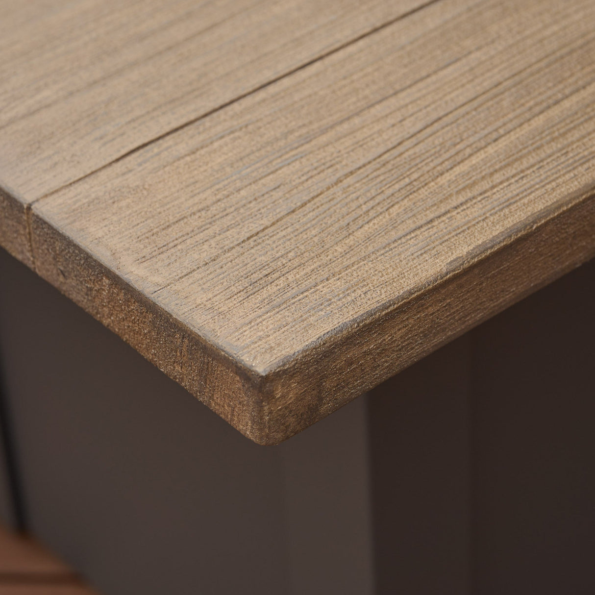 A close up view of the detail found on the Driftwood top on a Havenwood Rectangular Gas Fire Pit Table