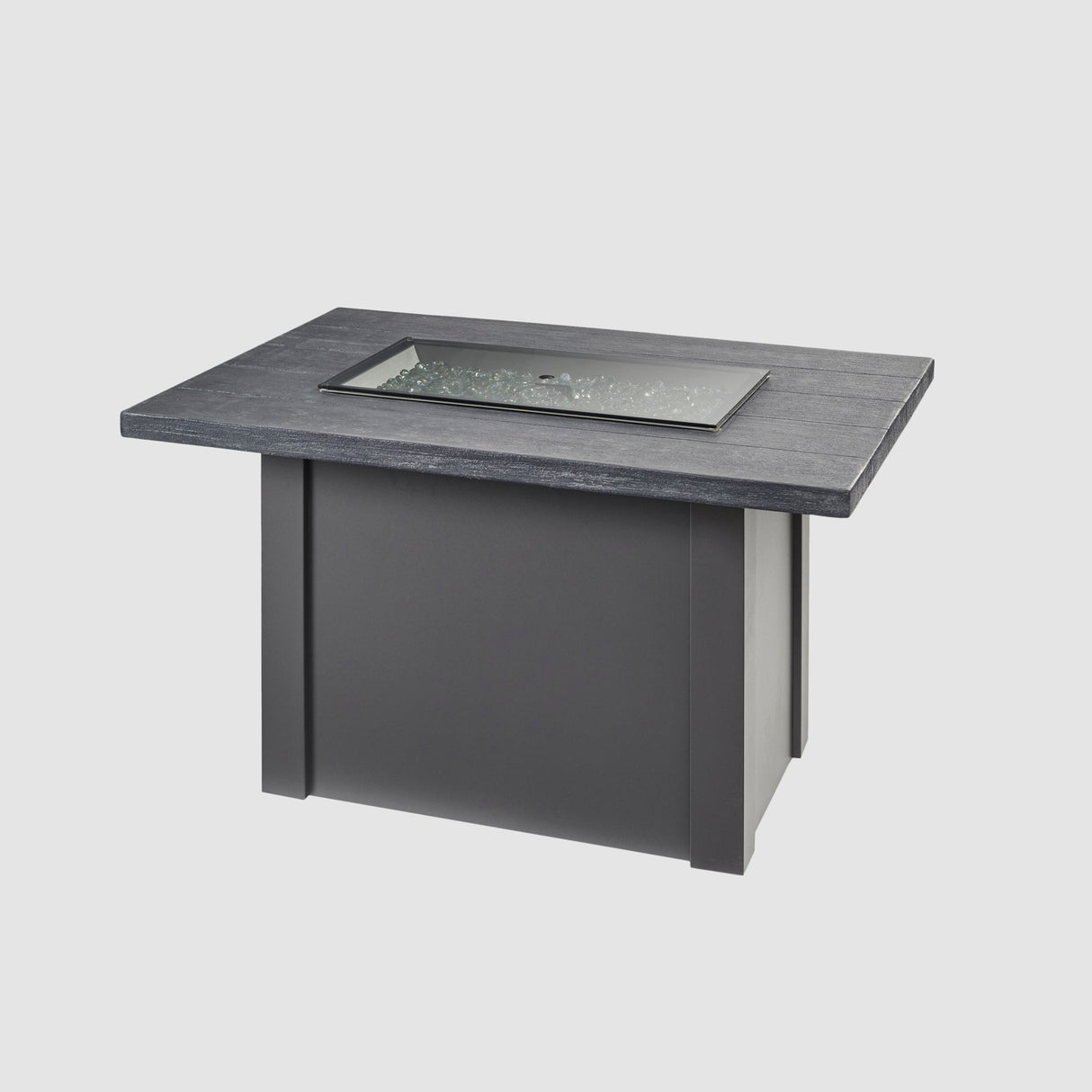 A grey glass burner cover on top of the Havenwood Rectangular Gas Fire Pit Table with a Carbon Grey top and Graphite Grey base