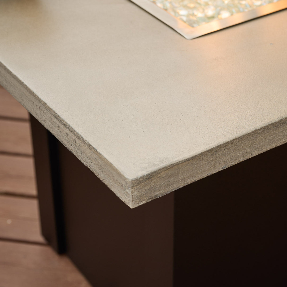 A close up view of the texture on the Pebble Grey Havenwood Rectangular Gas Fire Pit Table