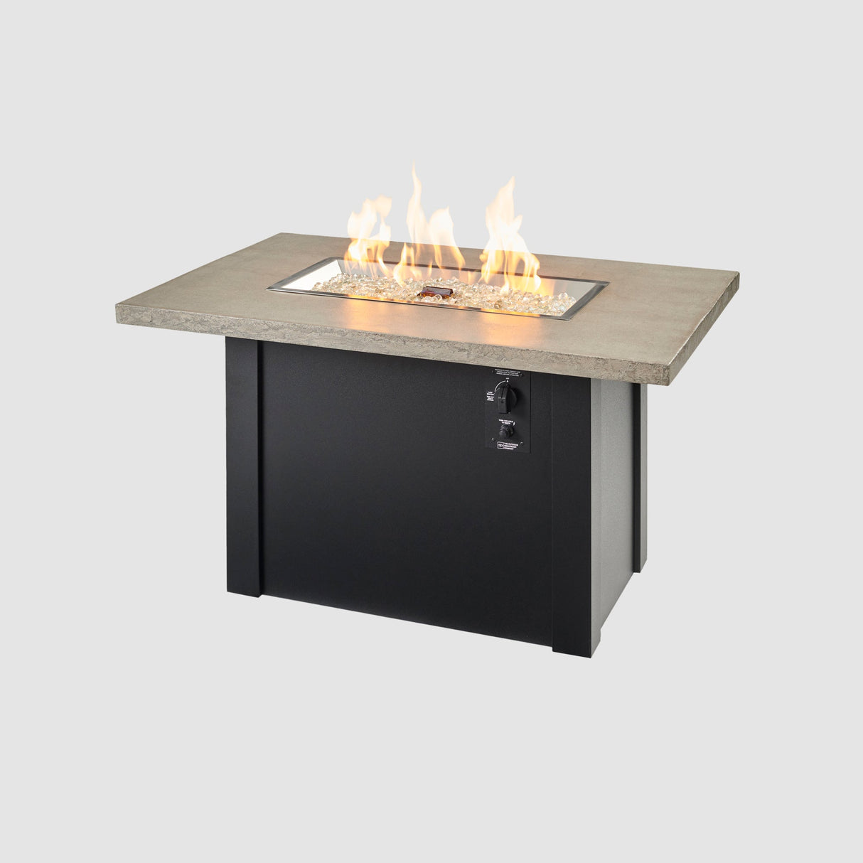 A large flame coming off the burner of a Havenwood Rectangular Gas Fire Pit Table with a Pebble Grey top and Luverne Black base