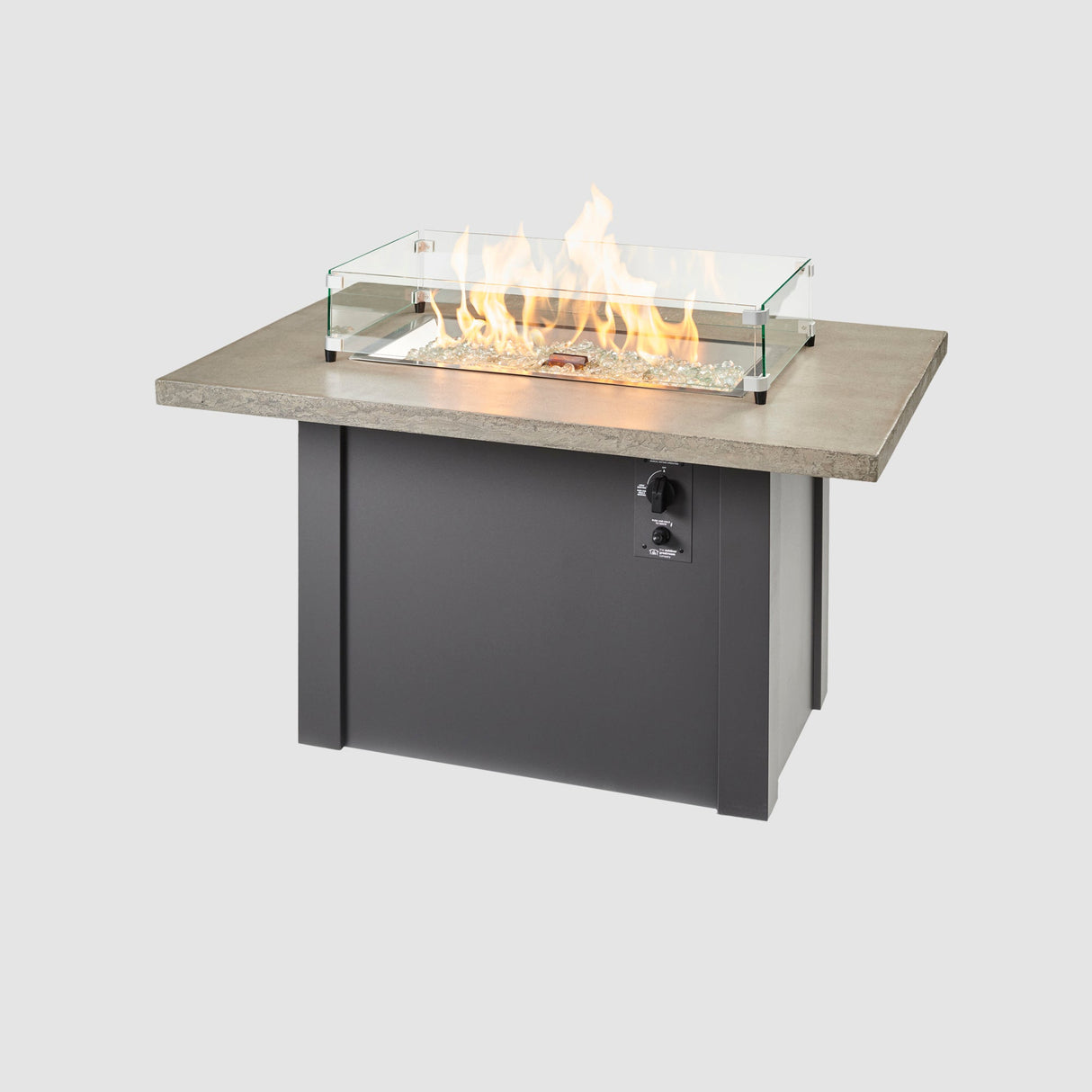A glass wind guard used on the burner of a Havenwood Rectangular Gas Fire Table with a Pebble Grey top and Graphite Grey base