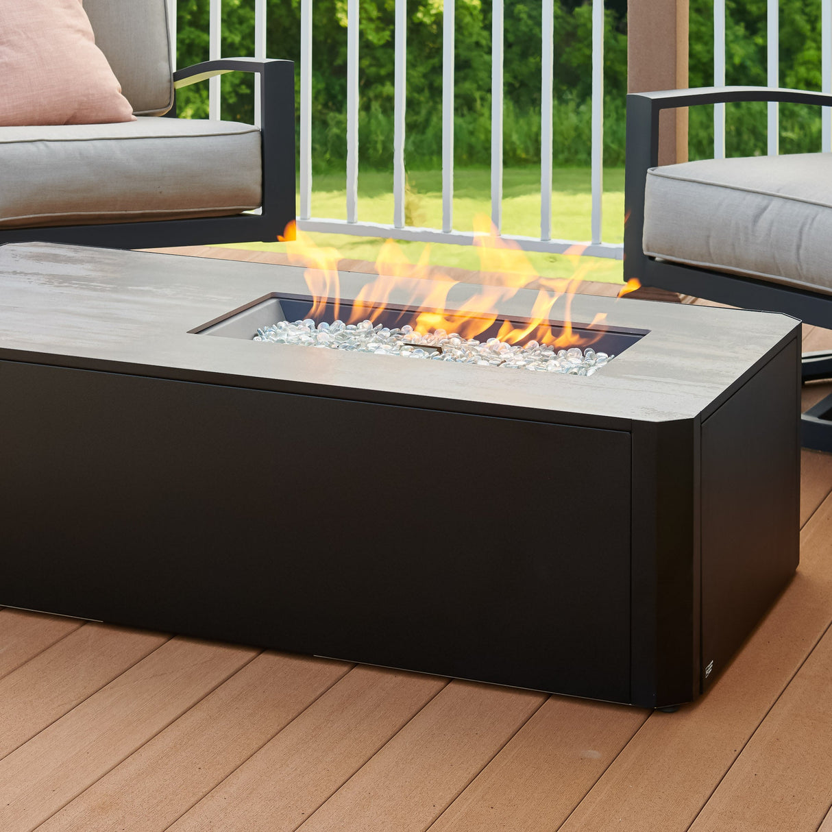 Close up of the flame coming from the Kinney Rectangular Gas Fire Pit Table in an outdoor setting