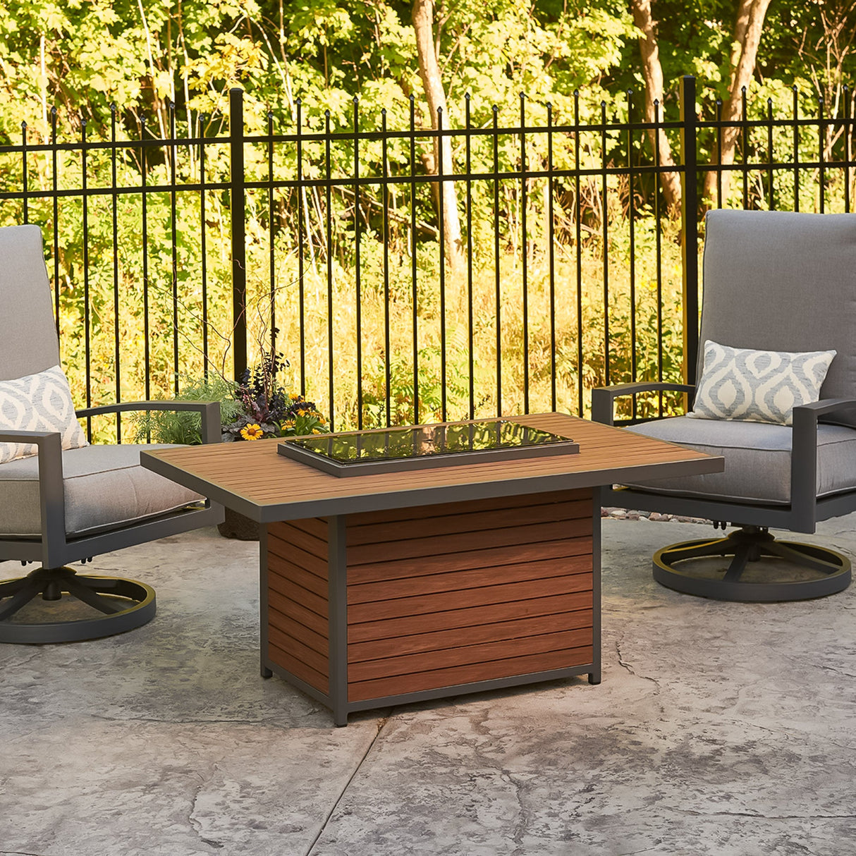 The Kenwood Rectangular Chat Height Gas Fire Pit Table acting as an outdoor table with the cover on top