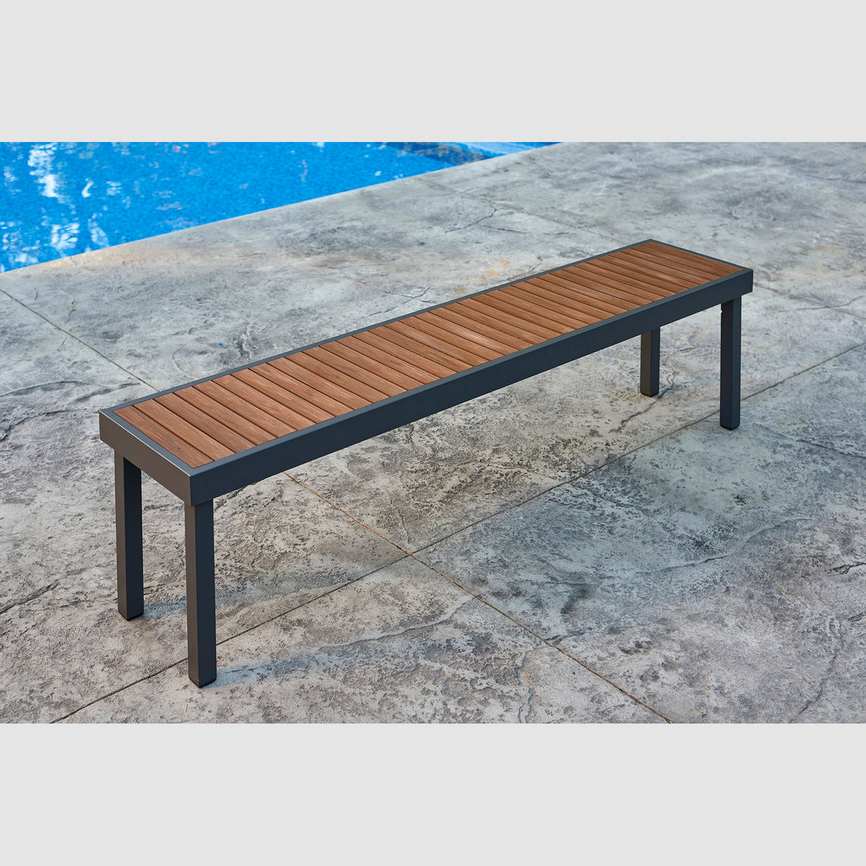 The Kenwood Long Bench poolside next to the water