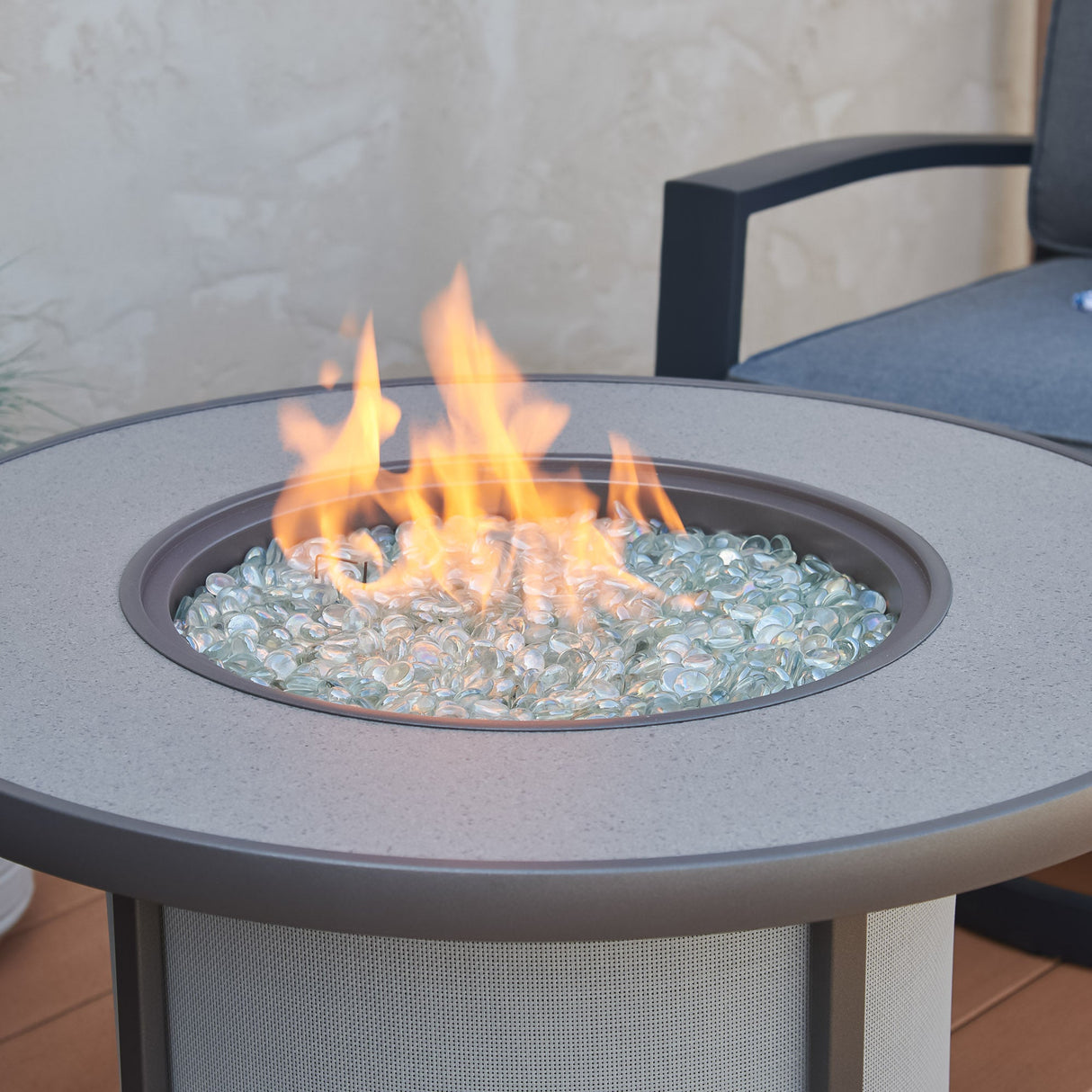 A close up of the flame coming from the Grey Stonefire Round Gas Fire Pit Table
