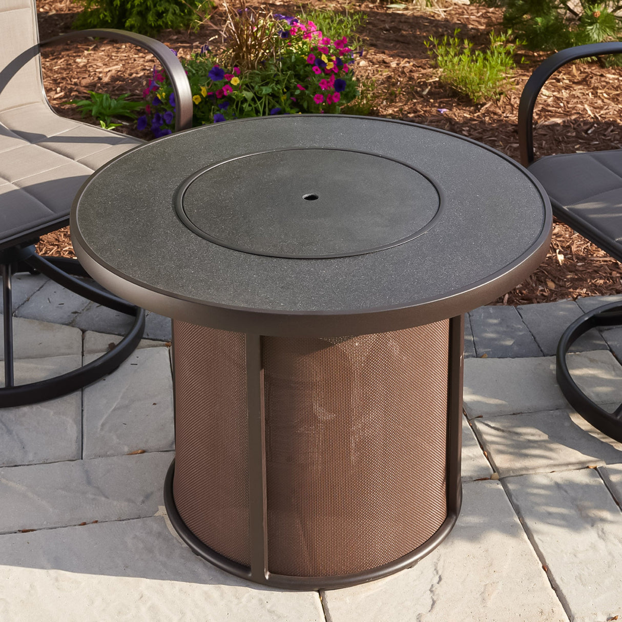 A cover placed on the top of a Brown Stonefire Round Gas Fire Pit Table