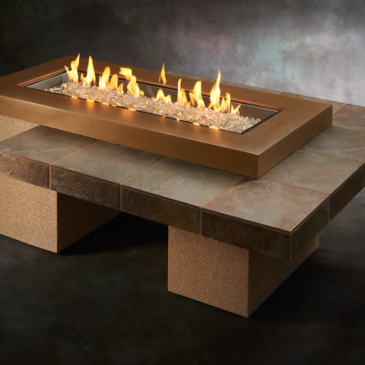 The Brown Uptown Linear Gas Fire Pit Table on a studio background