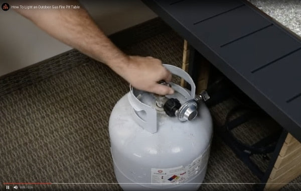 A thumbnail for a video that shows you how to light an outdoor gas fire pit table